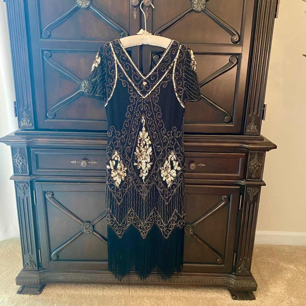 Black and gold sequin and fringed flapper dress